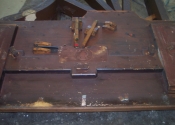 Underneath side of piano before painting and restoration of trapwork.